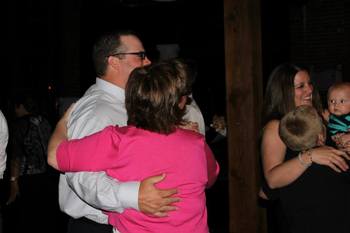 Mothers and sons flood the dance floor.