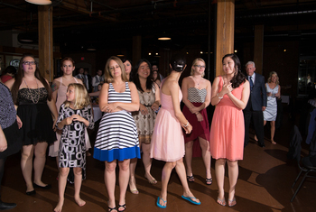 Single ladies lining up for the bouquet toss!