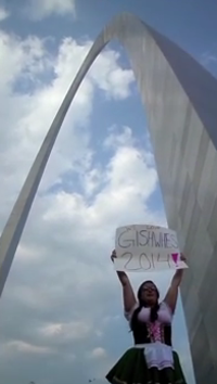 #19 (Video) Stand in front of a recognizable landmark or monument, wear something magnificent, and in whatever your native language is, complete the following sentence: ''Gishwhes makes me feel _____''